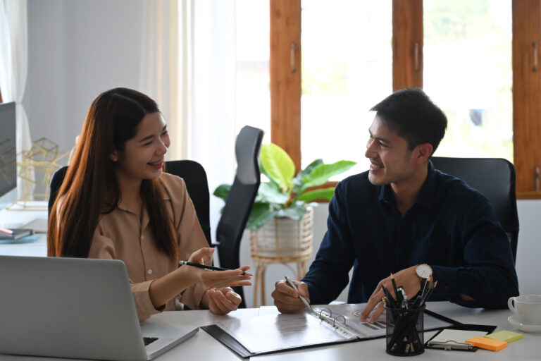 Two business partner discussing project strategy while having co