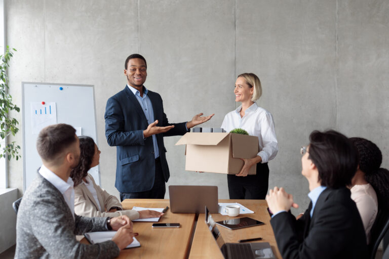 African Businessman Introducing New Employee During Corporate Meeting In Office